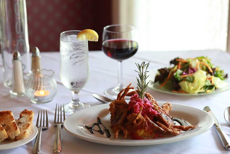 Fried appetizer with glass of red wine