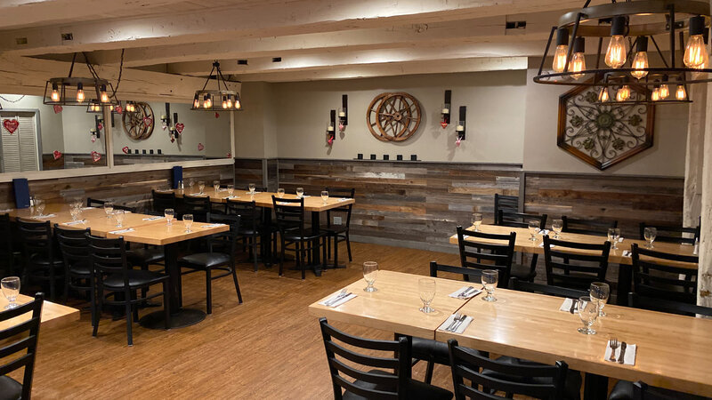 Fireplace room with many set tables - The Village Inn - Gallery Photo 2 Fireplace room with many set tables